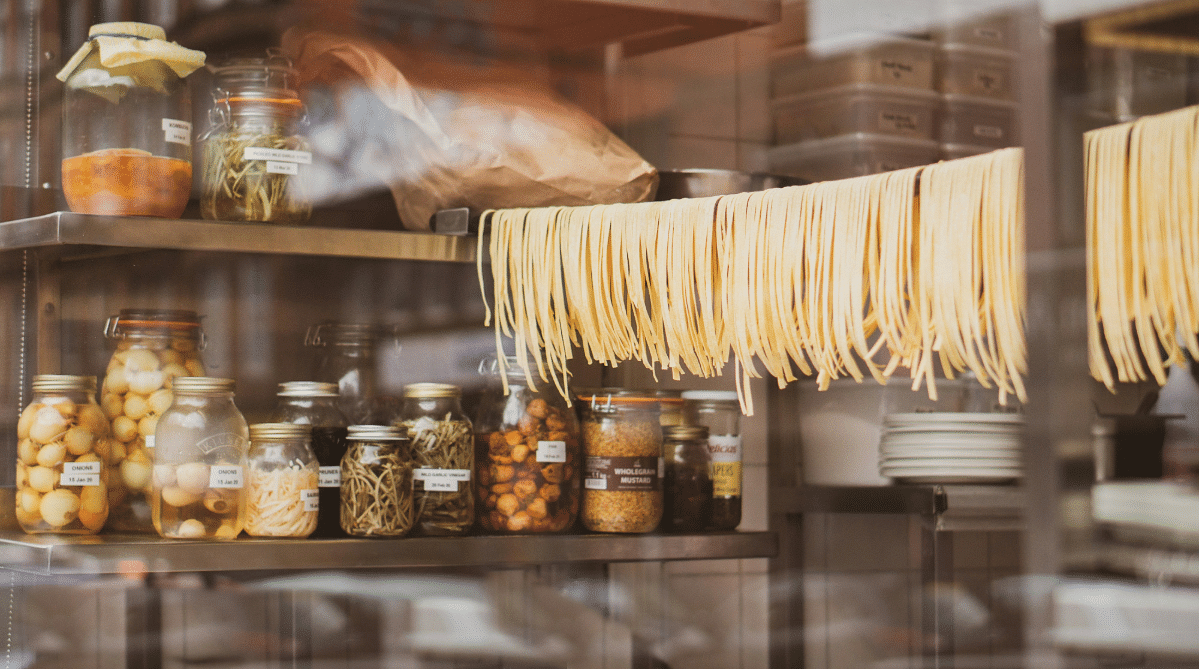 Pasta hanging to dry in a pantry
