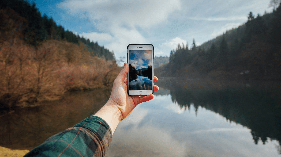 Traveler taking a photo with a smartphone
