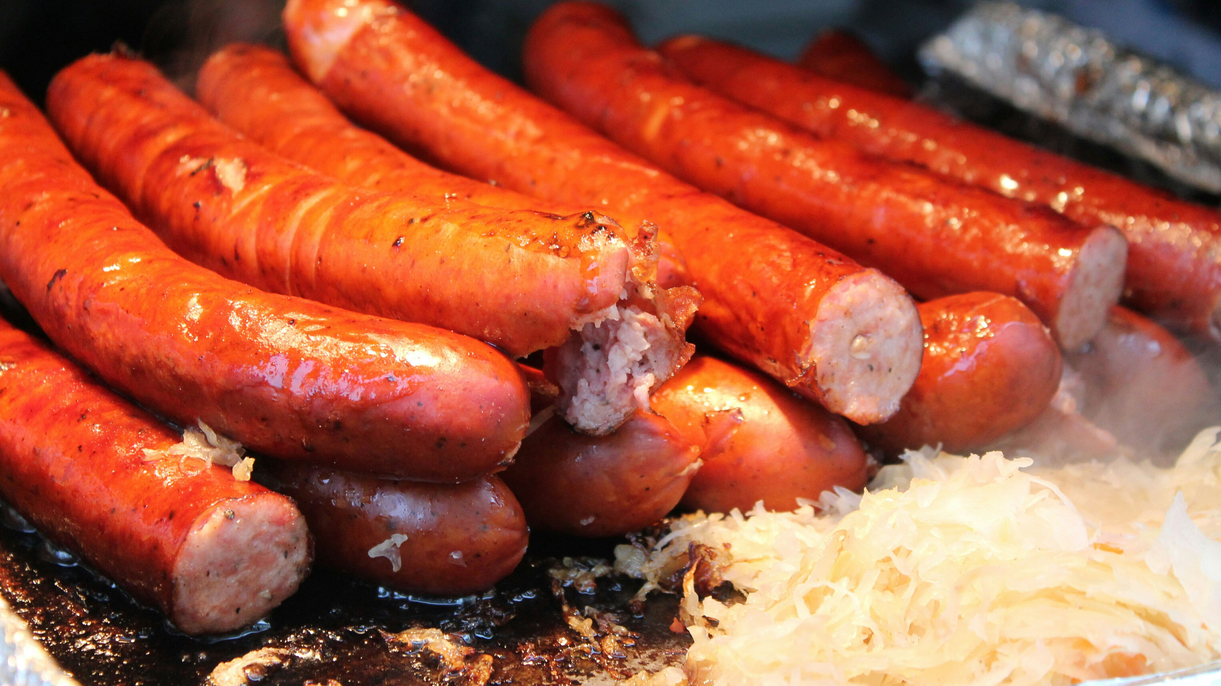 German sausages cooking on a grill