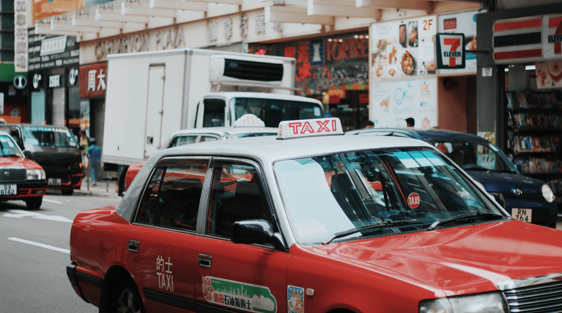 taxi driving through hong kong