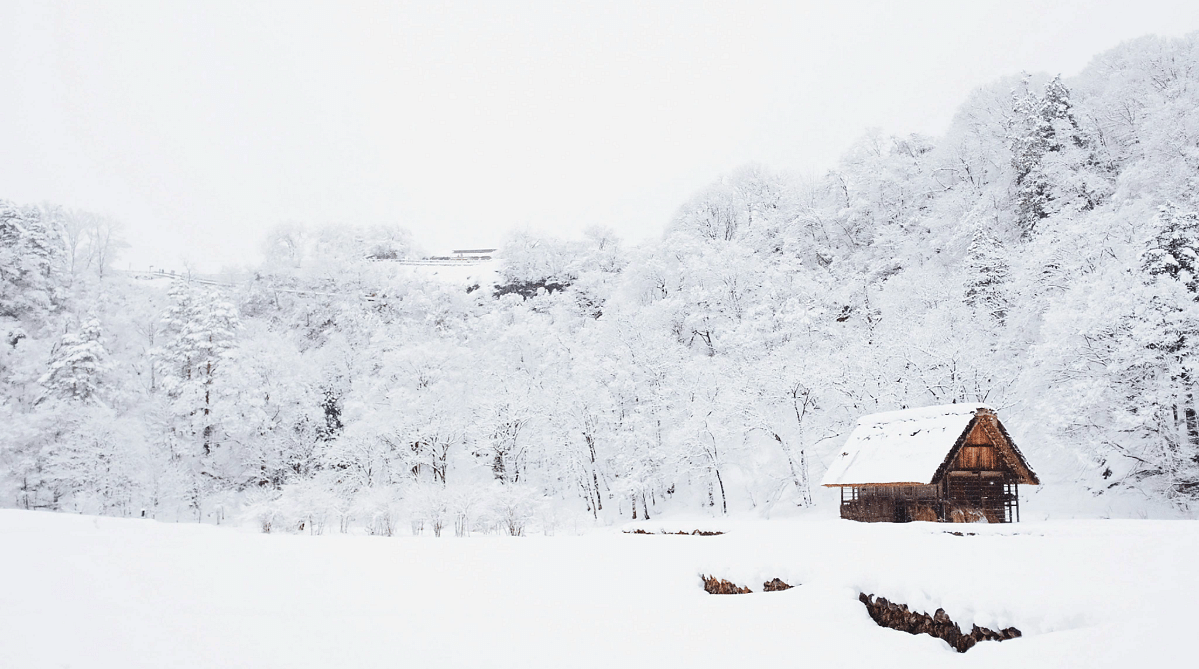 Snowy landscape with a farmhouse in Shirakawa-go, Japan