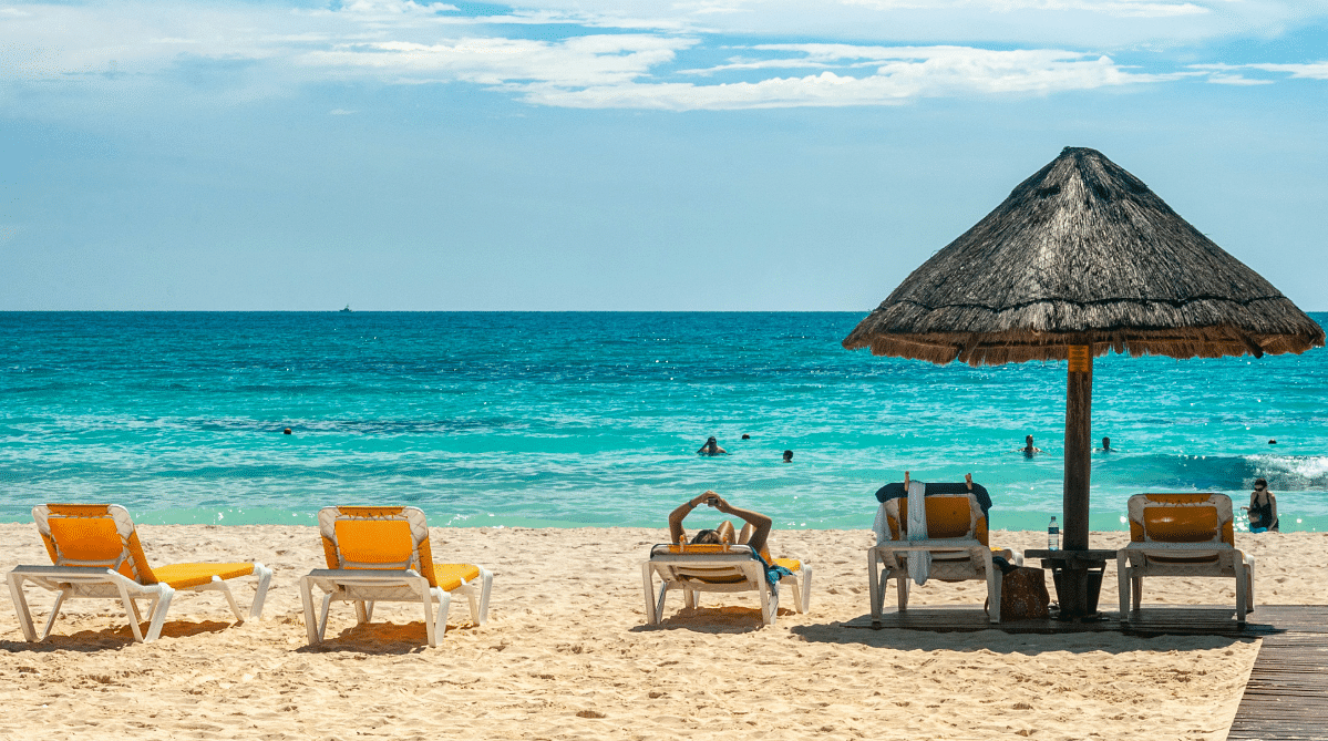 Beach chairs and umbrella in Cancun, Mexico