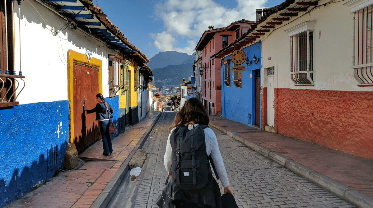 Traveler walking down a street in Colombia