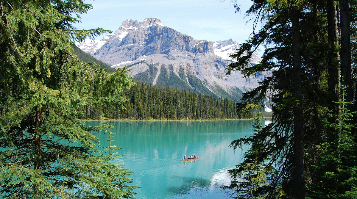 People canoeing on Emerald Lake in Canada