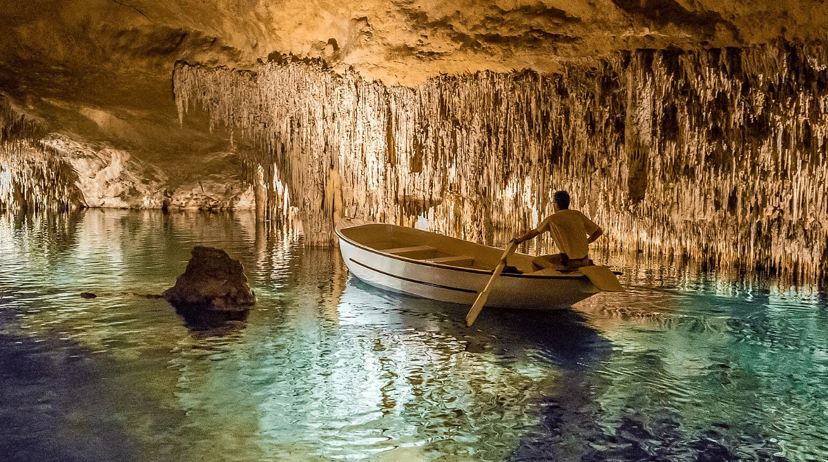 Man rowing a boat in the Caves of Drach, Mallorca