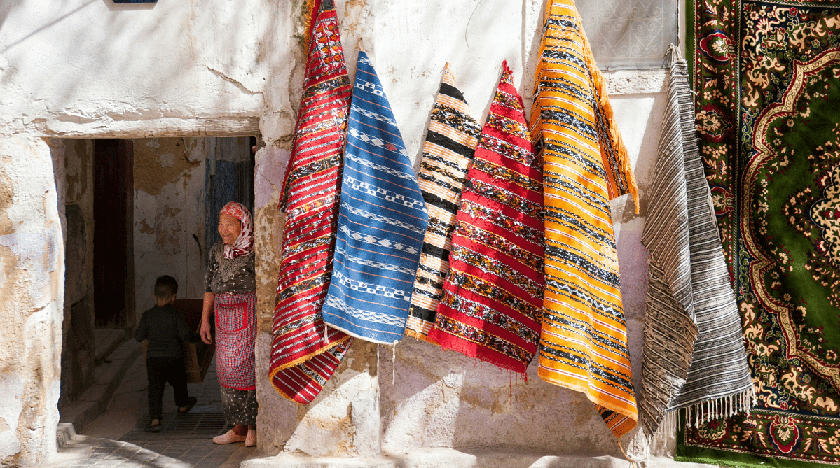 woman selling rugs in Morocco