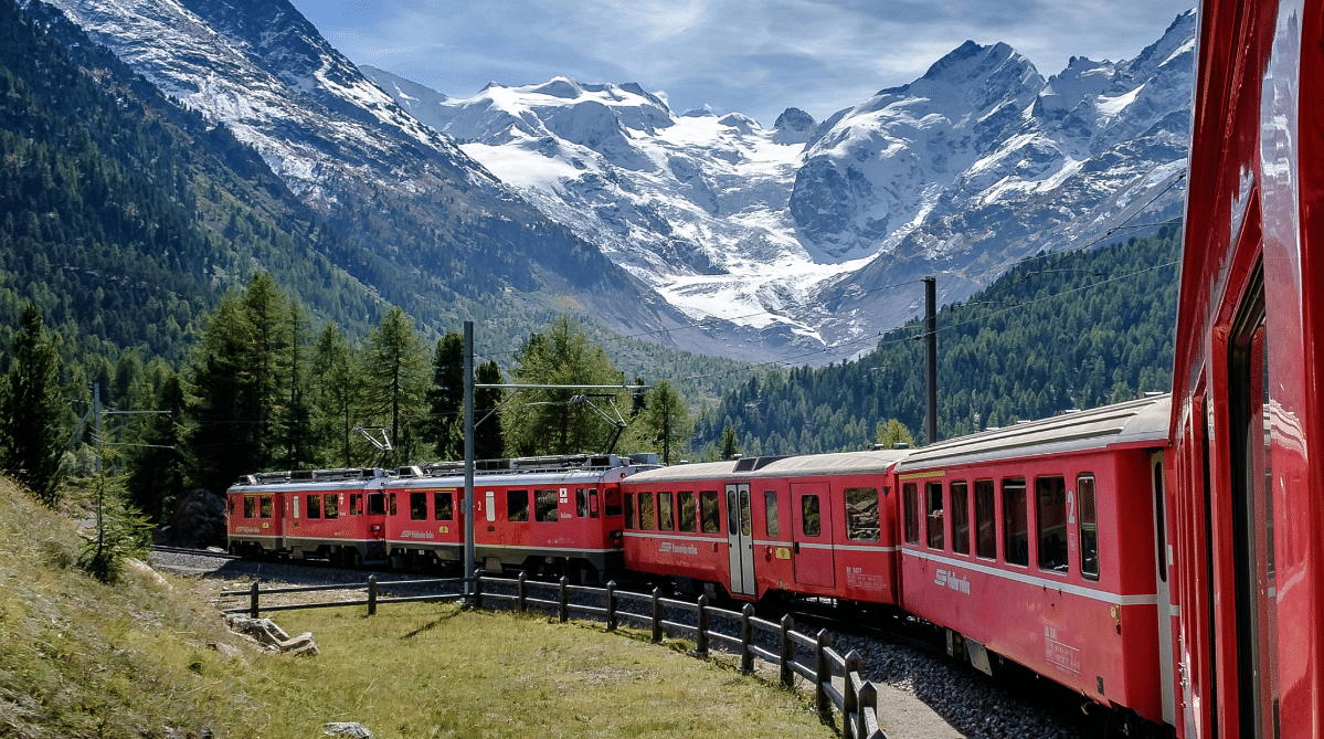 Train traveling through the Swiss Alps