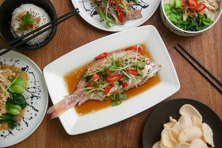 Chinese New Year dishes including a Steamed whole fish