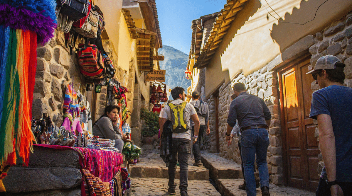 Traveler walking down a street in Cusco, Peru