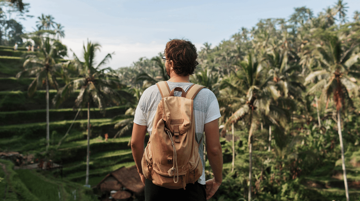 Traveler standing among rice terraces in Ubud, Bali