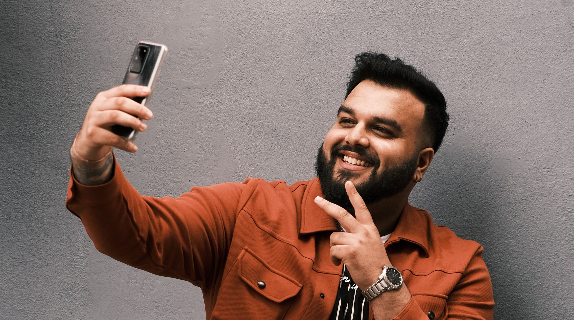 man taking a selfie with a smartphone