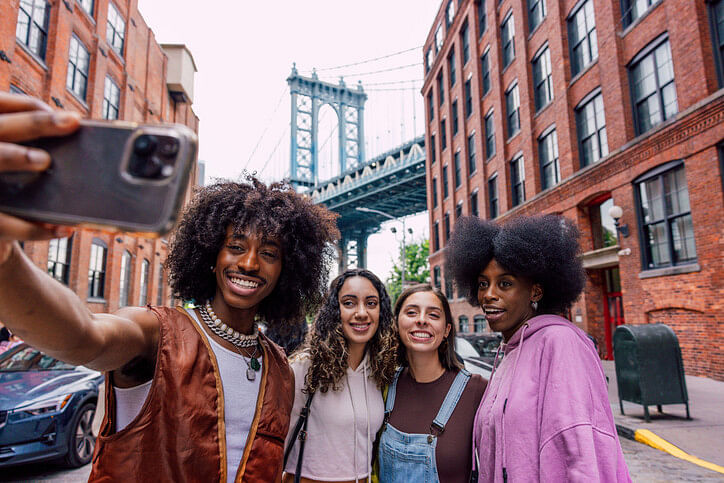 Group of friends with phone in New York