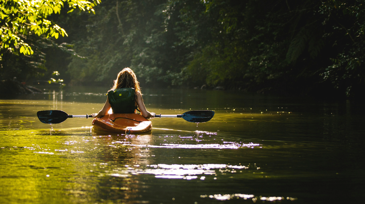 Woman paddling a kayak in Drake Bay, Costa Rica
