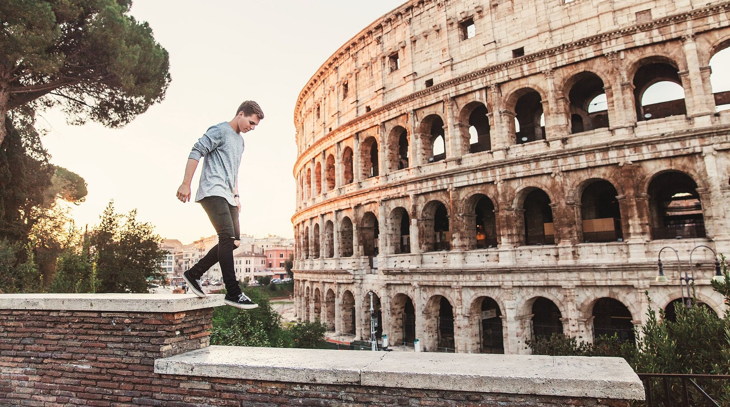 teenager outside of the Colisseum in Rome