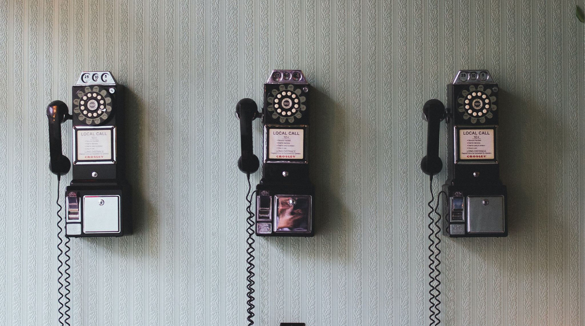 Old phones on a wall