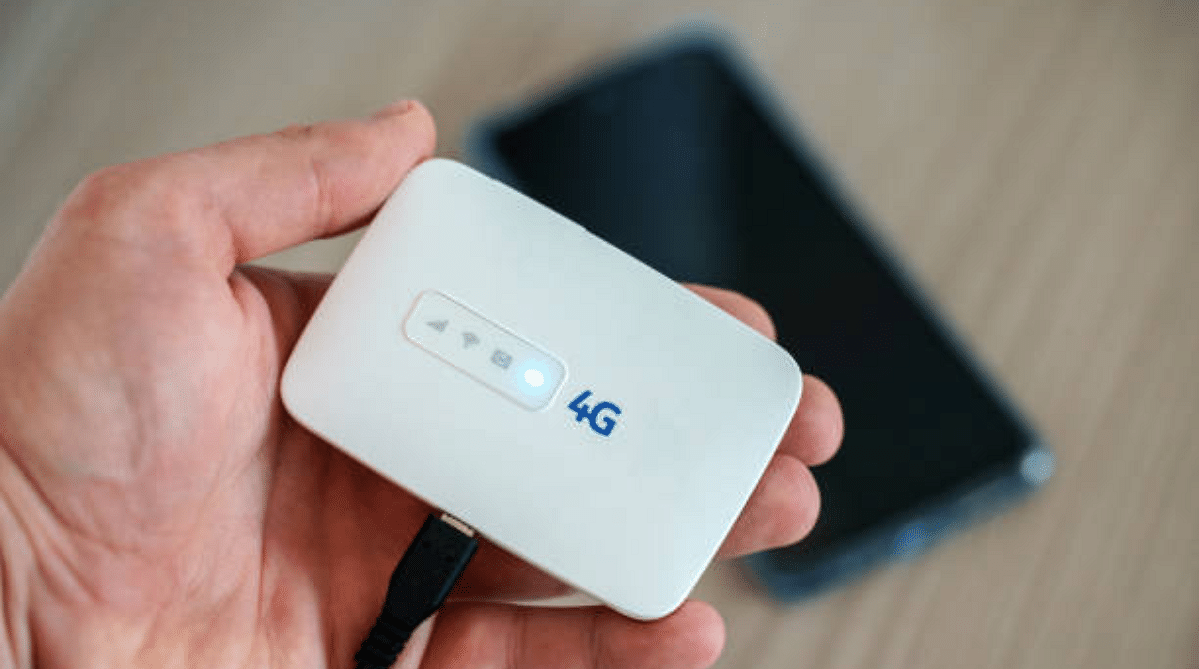 Someone holding a portable Wi-Fi in their hands