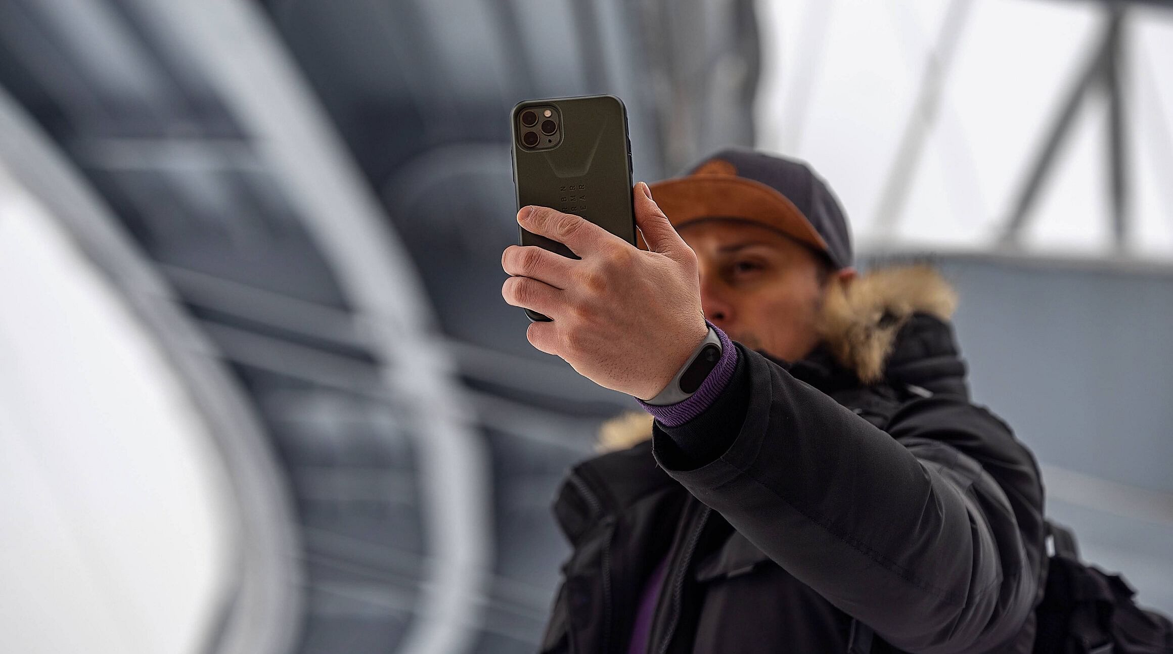 man using a smartphone in Paris