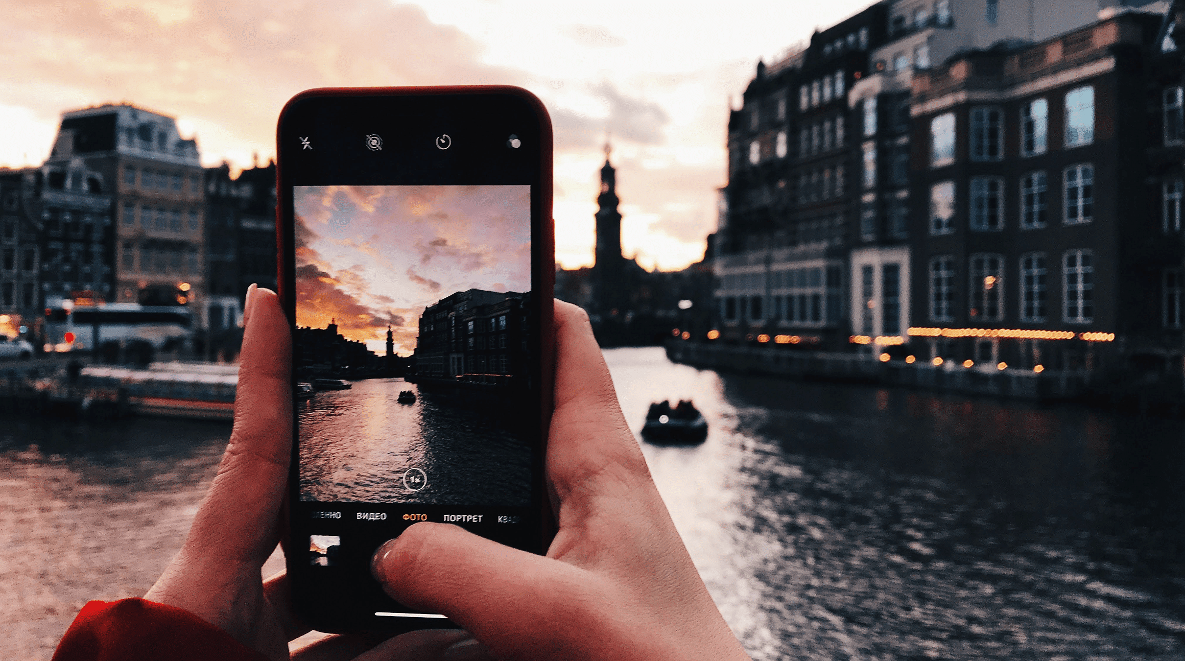 person using smartphone to take a travel photo in Europe