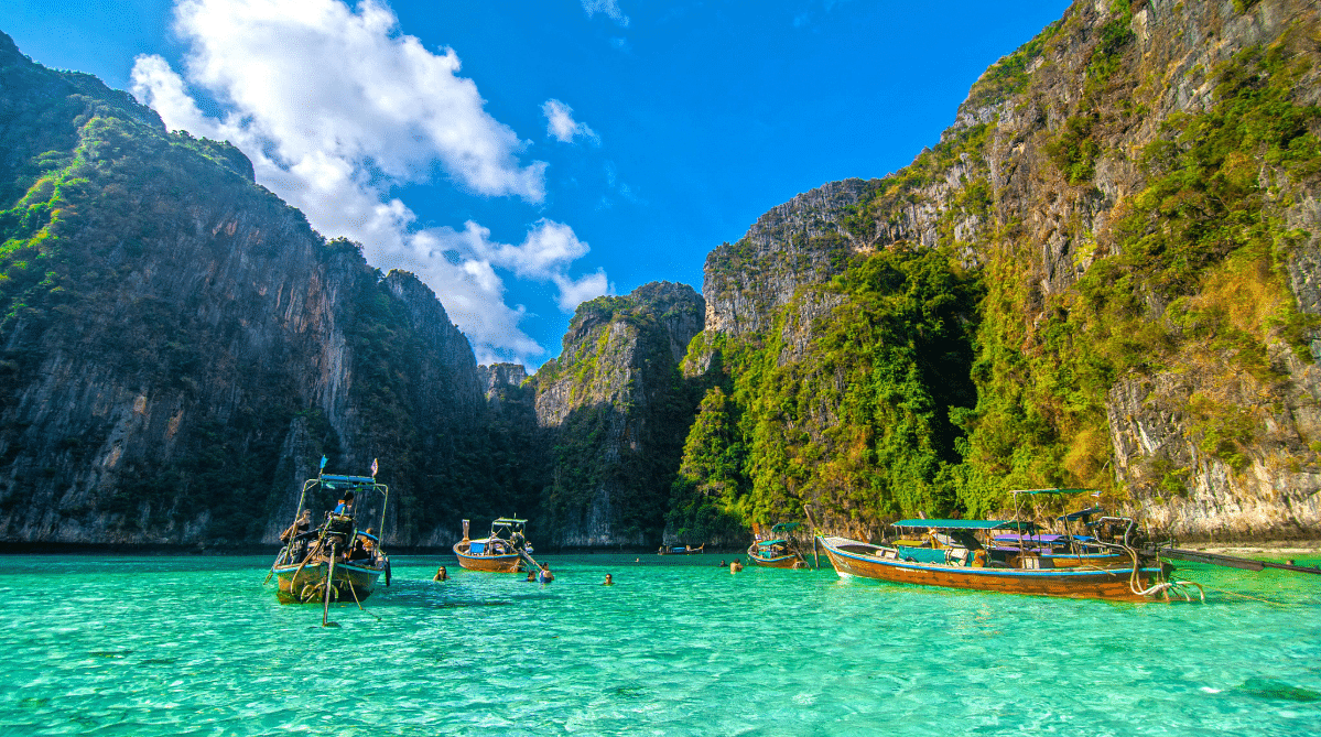 Boats and limestone cliffs in Koh Phi Phi, Thailand