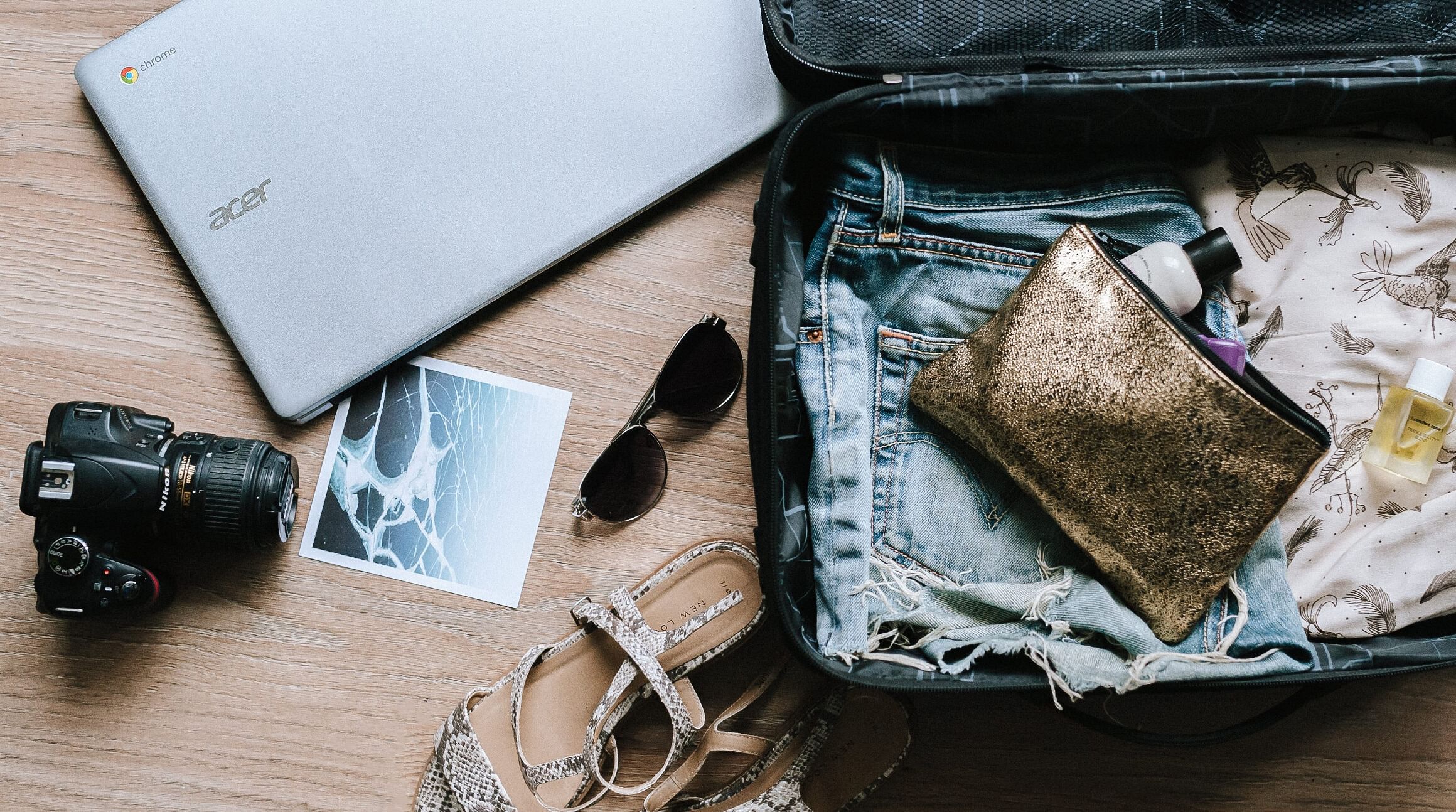 open carry-on bag packed with clothing