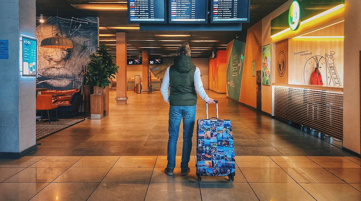 Traveler with checked luggage