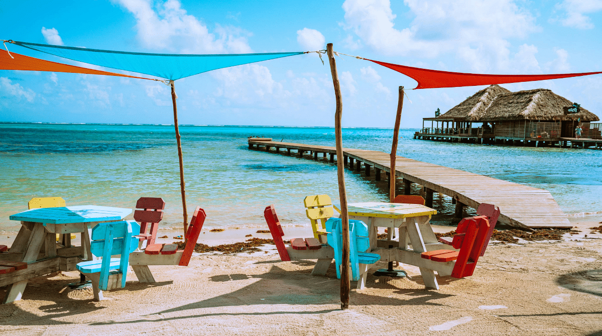 Colorful chairs and tables on a beach in Ambergris Caye, Belize