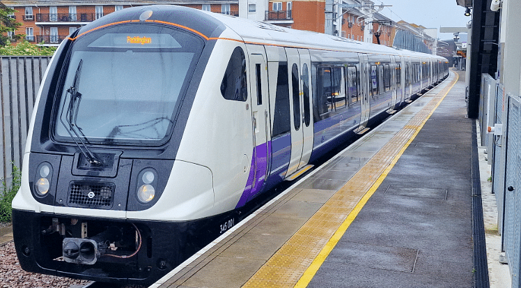 An image of a train on the Elizabeth Line pulling into a London over land train station, to illustrate a blog post entitled The Cheapest Way to Get to Heathrow Airport from London.