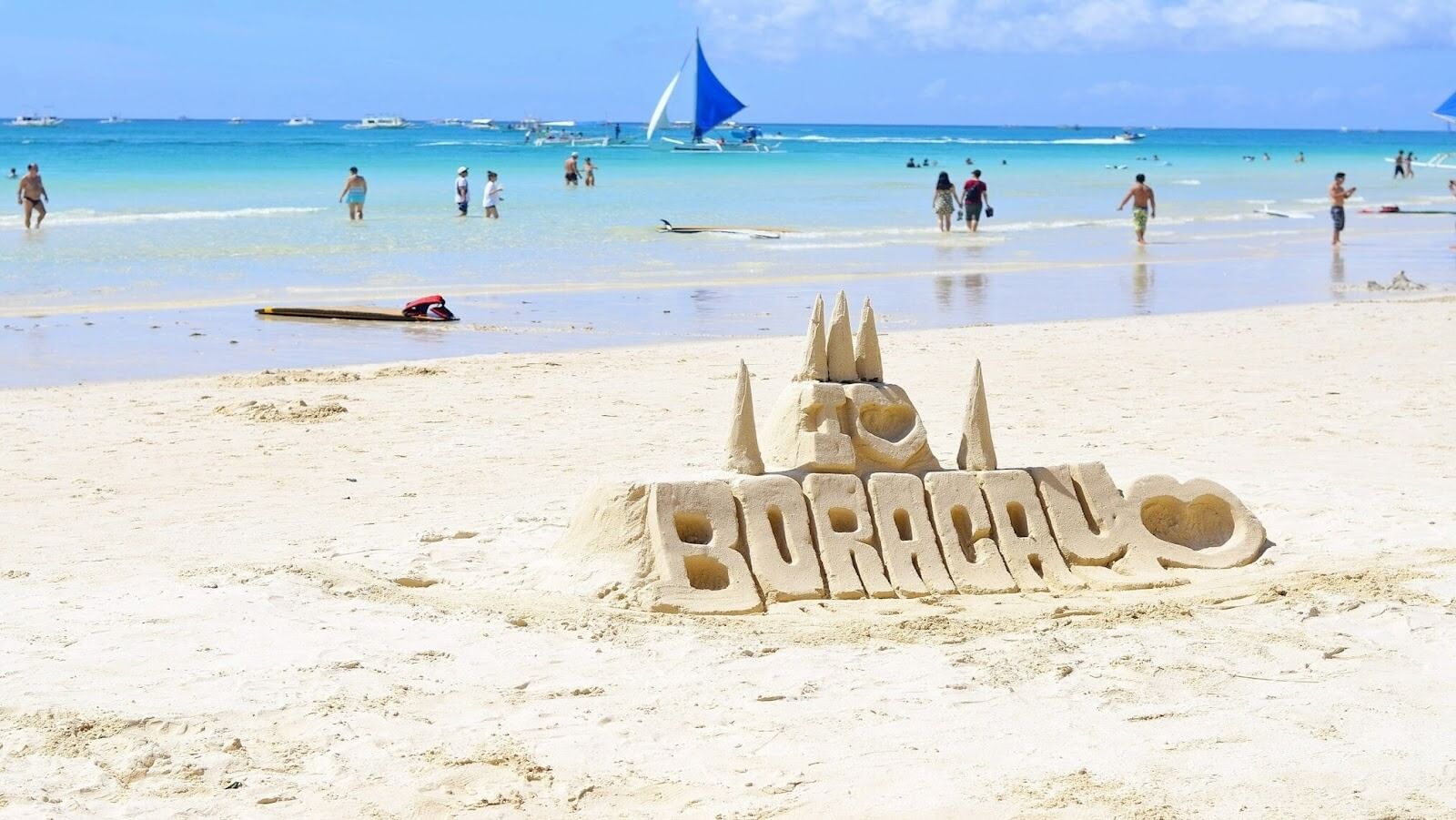 People walking in a beach with white sand during daytime