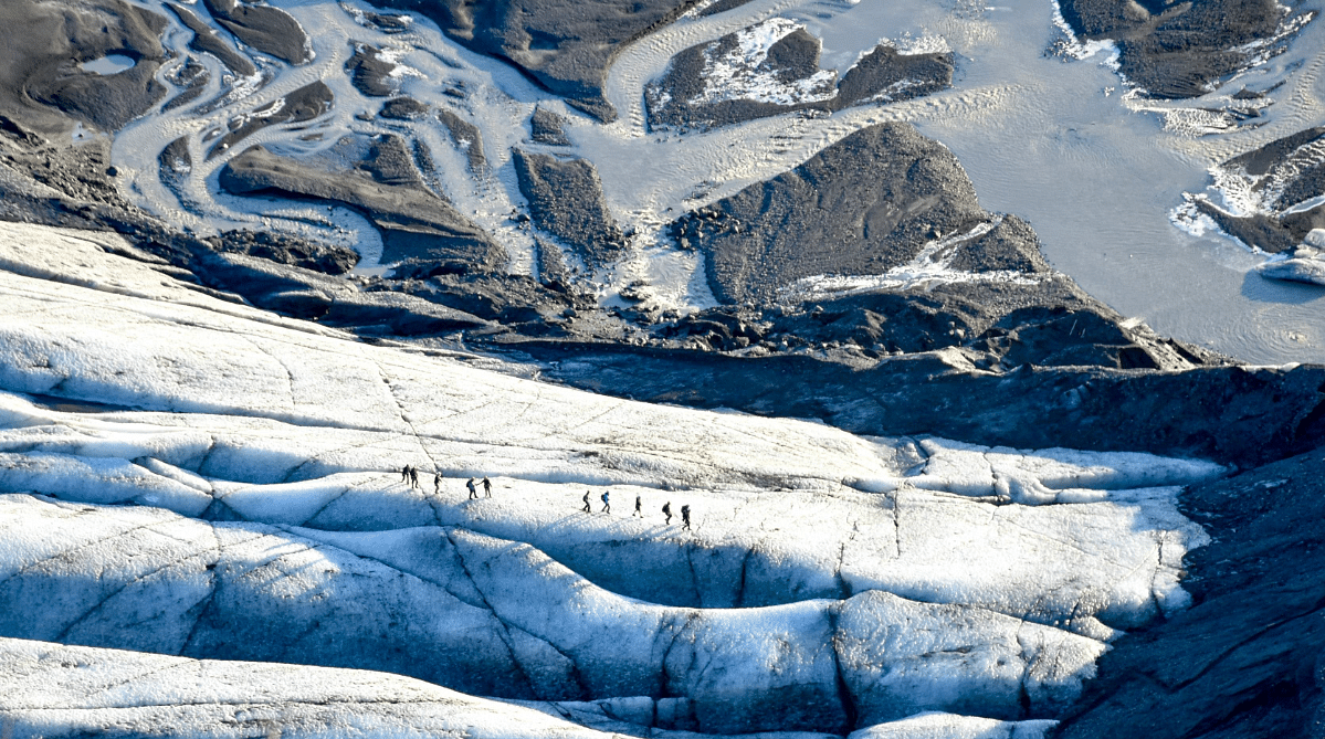 People walking across Vatnajökull glacier, Iceland