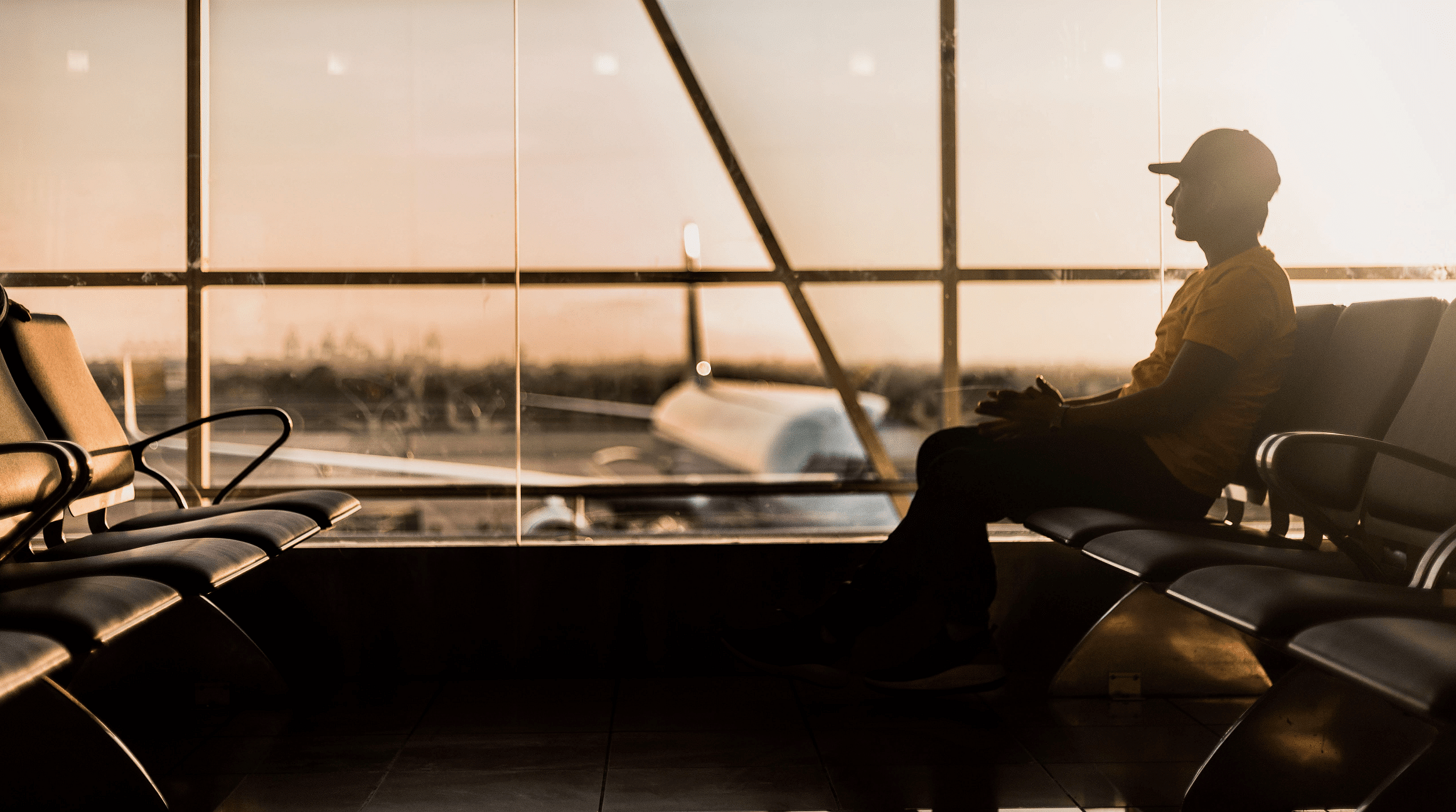 man waiting at airport gate