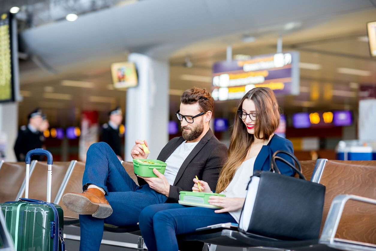 Couple eating at the airport