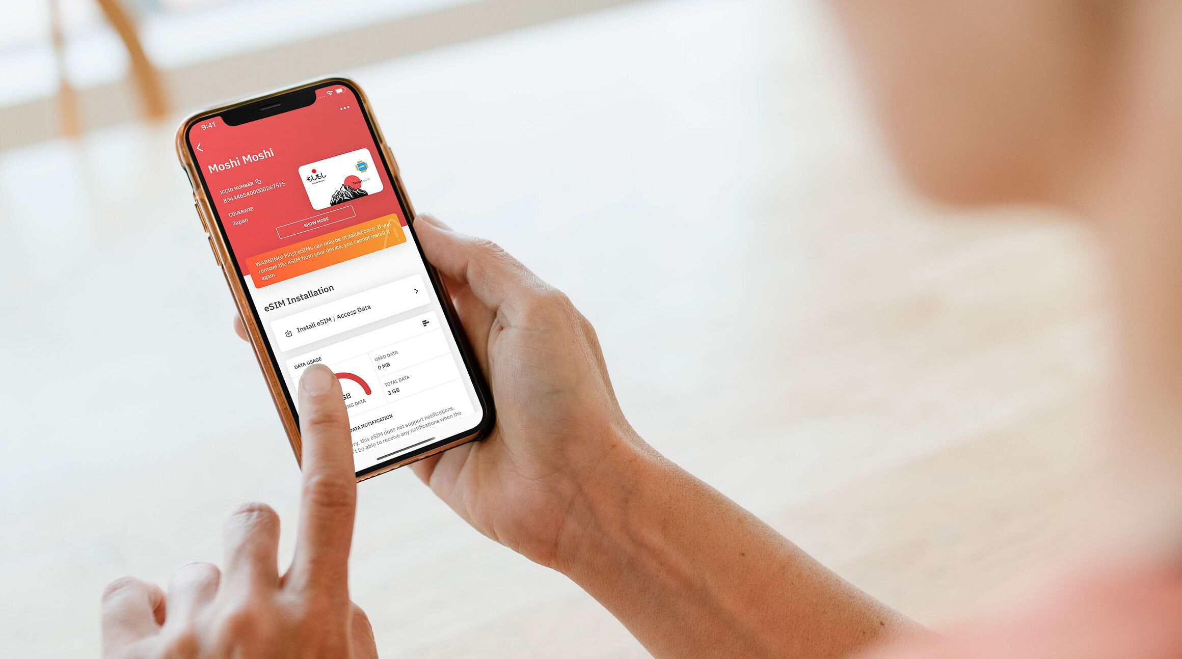 woman looking at a Japan eSIM on the Airalo app