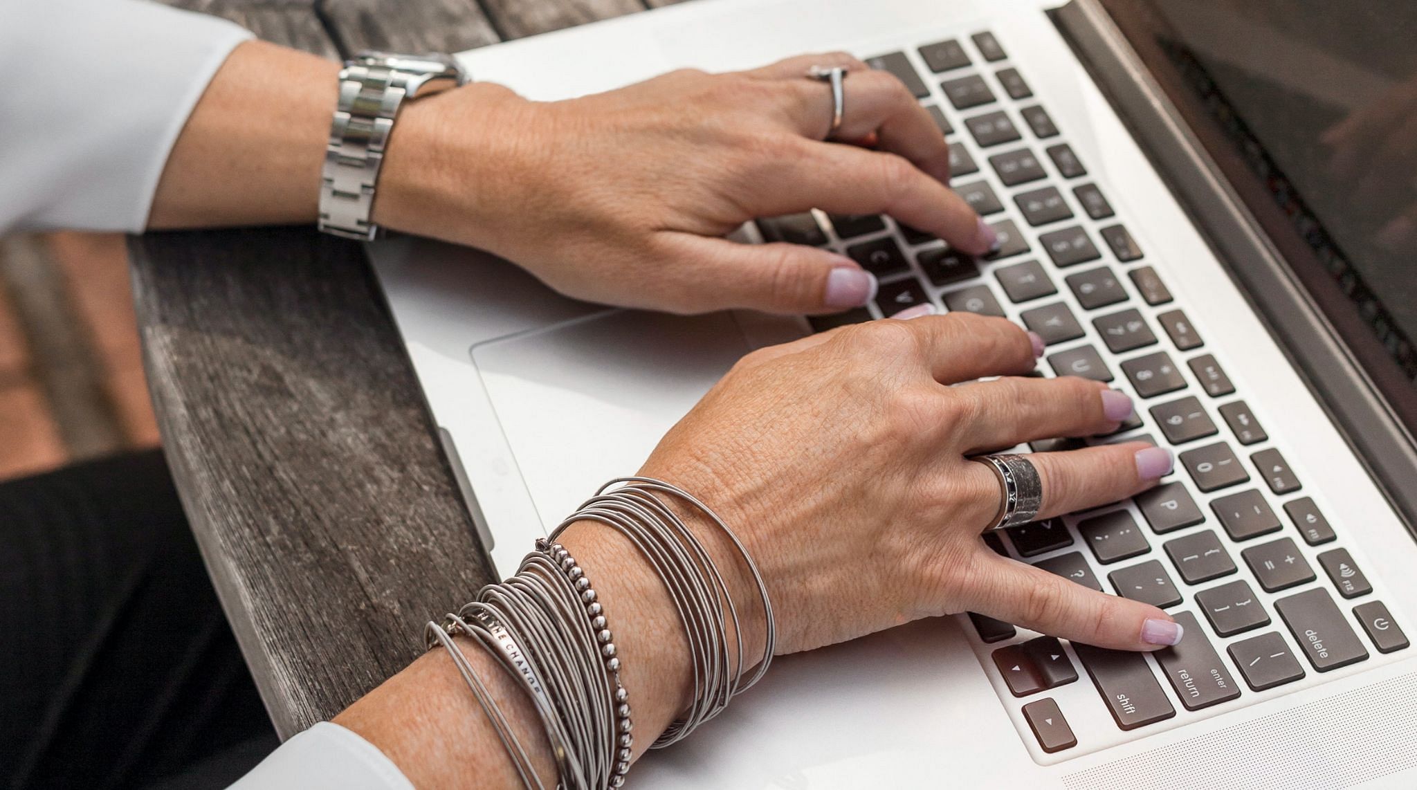 woman typing on laptop