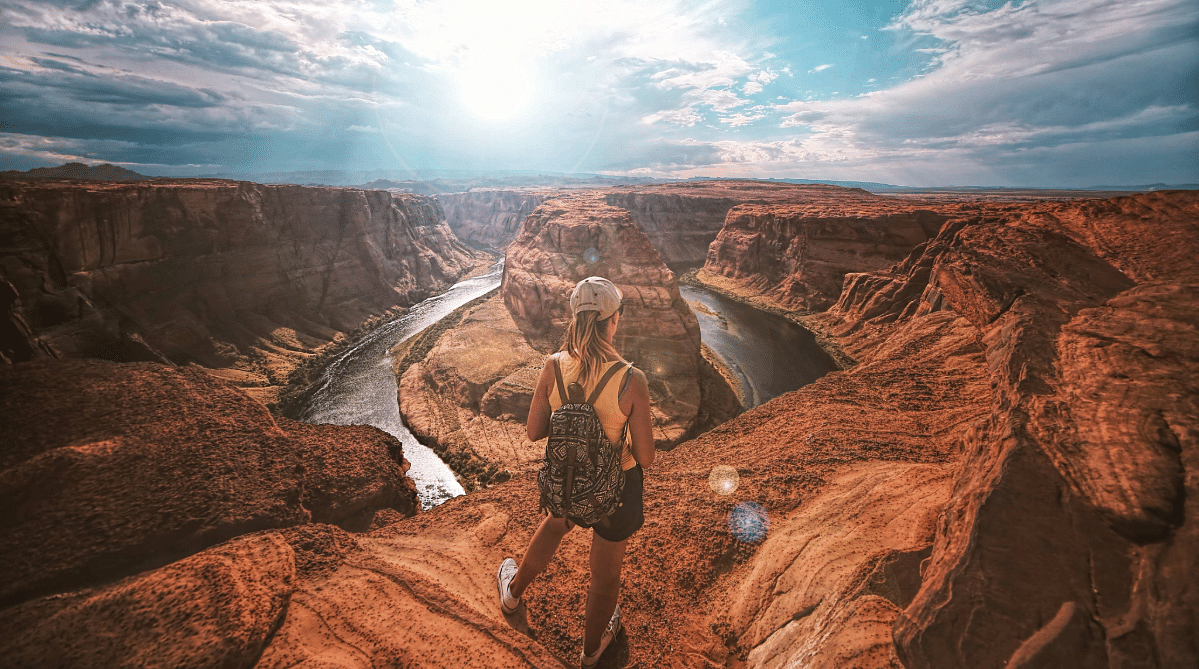 Girl standing at the edge of the Grand Canyon