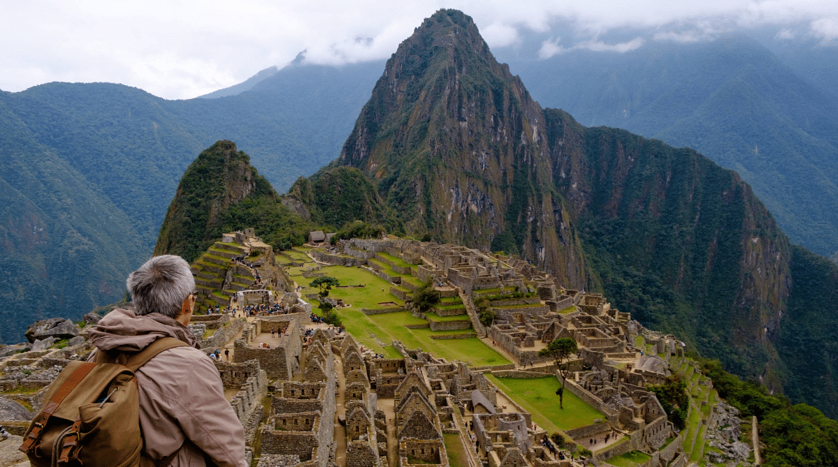 Traveler looking at Machu Picchu in Peru