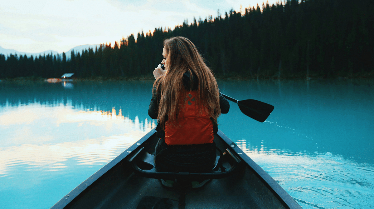 traveler canoeing on Lake Louise, Banff, Alberta