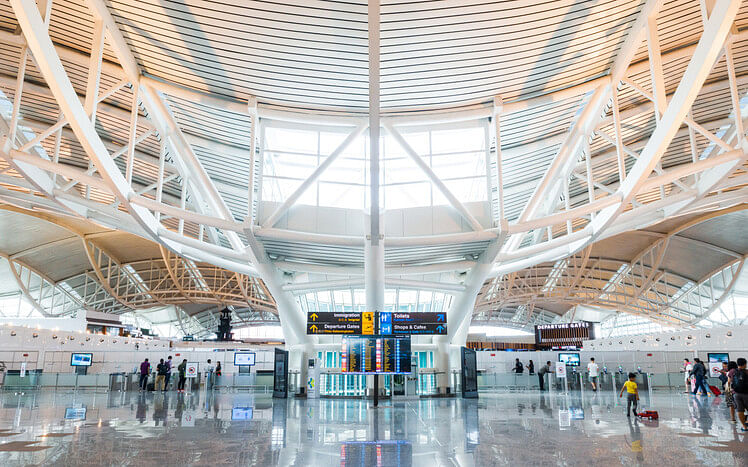 Airport with people and signs