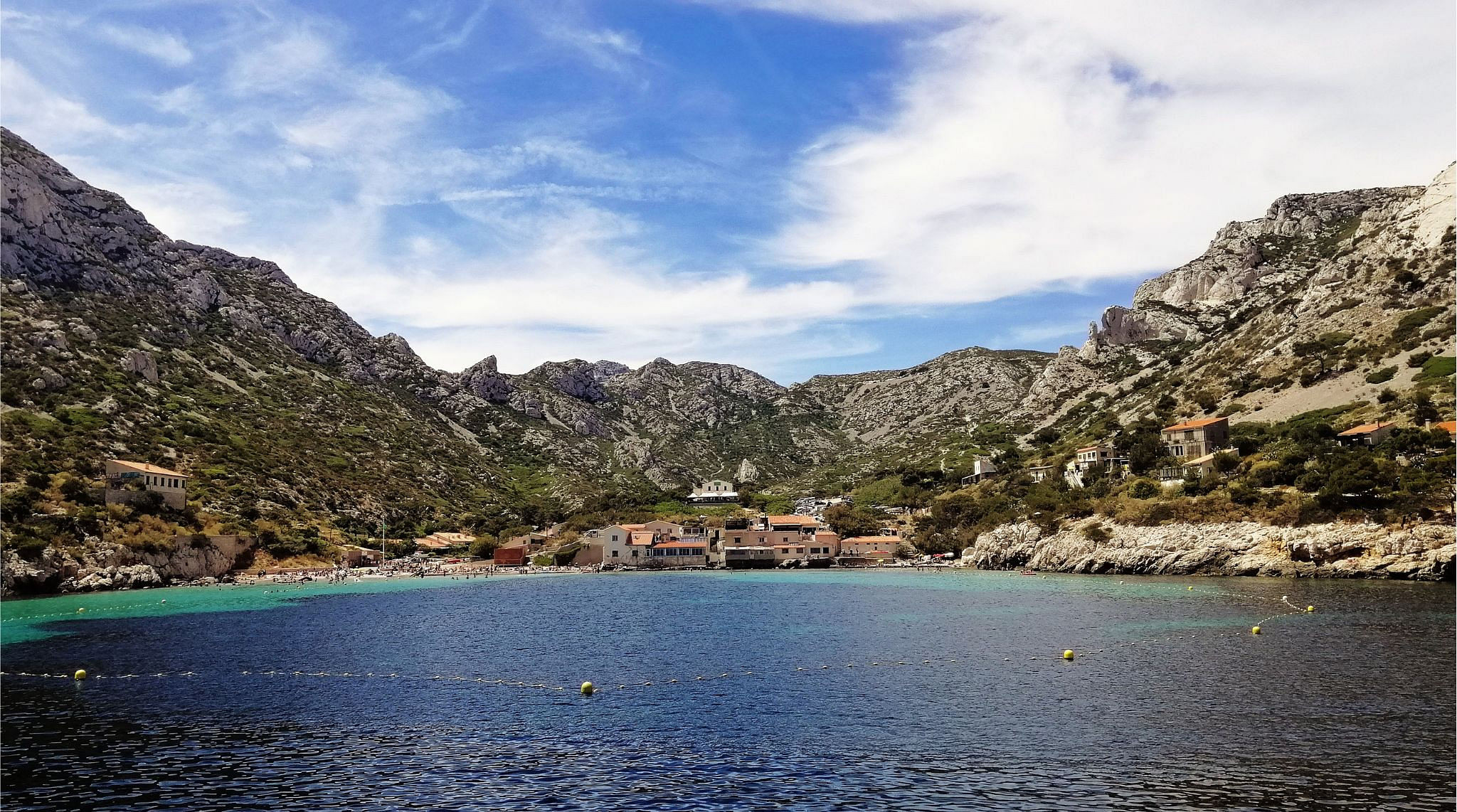 amazing view of Calanques covered in greenery surrounded by the sea in Marseille in France