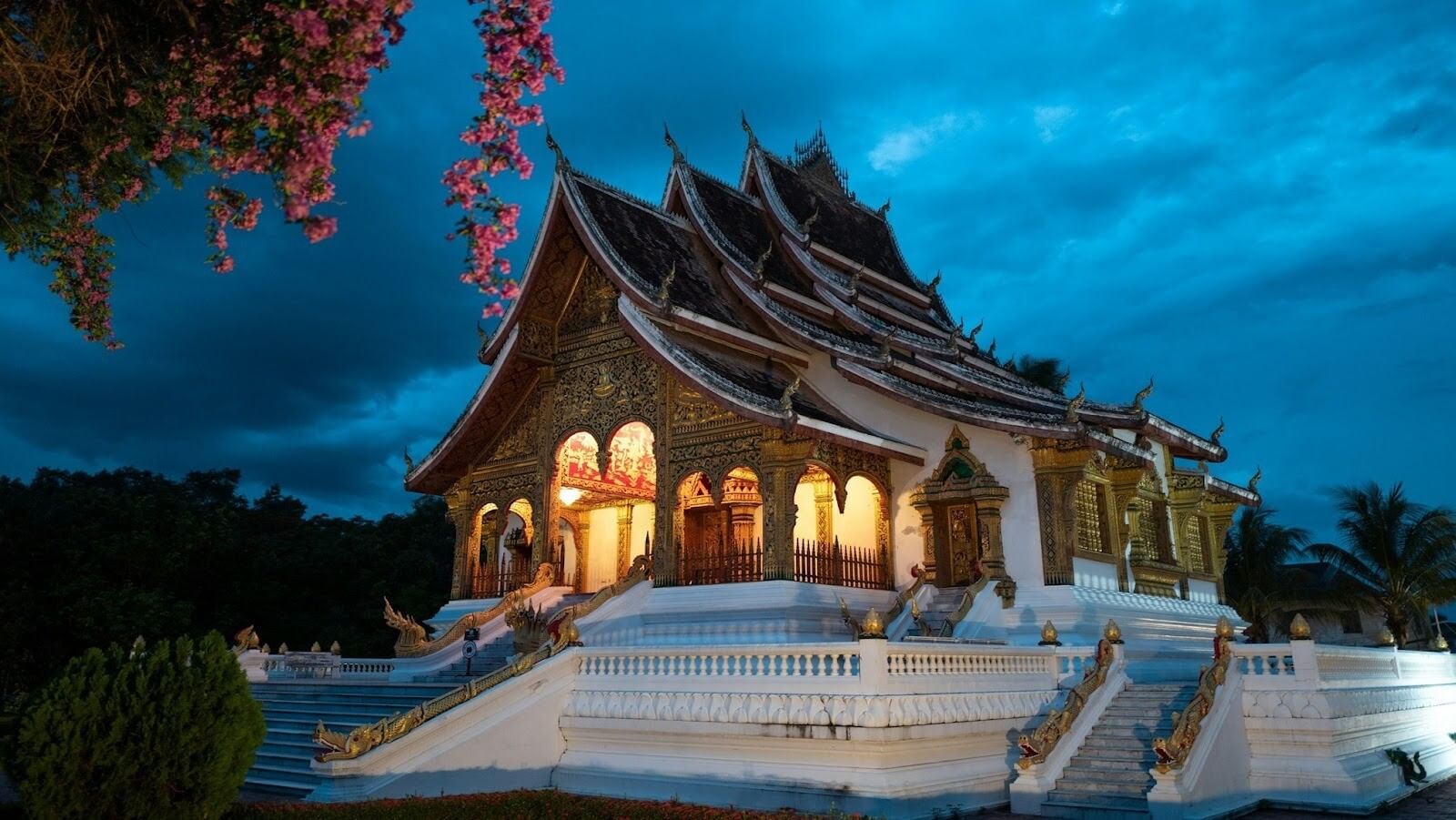 Evening view of a brown and white building with many windows in Laos